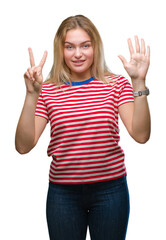 Young caucasian woman over isolated background showing and pointing up with fingers number seven while smiling confident and happy.