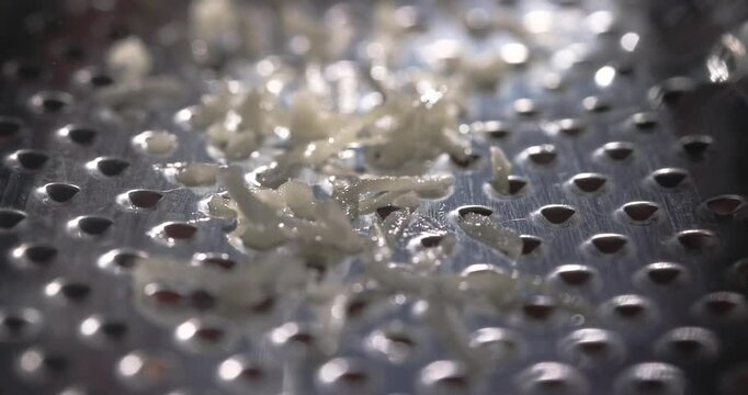 Grate the garlic on a fine grater. 