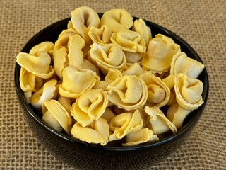 Italian tortellini (capeletti, agnolini) pasta in a bowl. Soup.