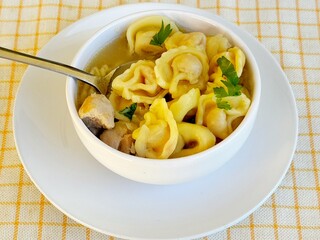 Soup. Italian tortellini soup (capeletti, agnolini) with chicken and vegetables. Special meal, starter or nutritious side dish or for a cold winter day.