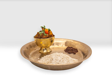 Delicious Flaky Rice and Fried Chicken Spicy Nepali masu chiura lunch on a plate chicken curry fried