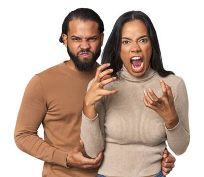 Young Latino couple in studio screaming with rage.