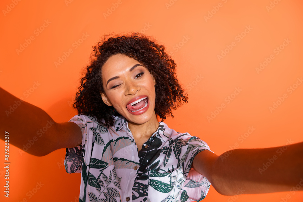 Wall mural Photo of cheerful carefree girl wink lick tongue recording selfie isolated bright color background - Wall murals