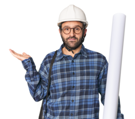 Hispanic male architect with plans showing a copy space on a palm and holding another hand on waist.