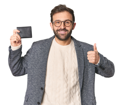 Hispanic male with briefcase in studio smiling and raising thumb up