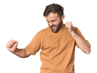 Studio portrait of young Hispanic male dancing and having fun.