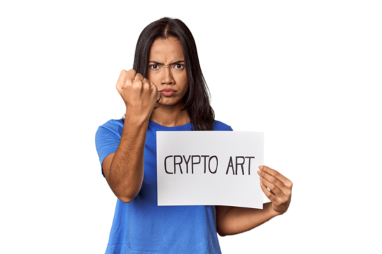 Woman with "crypto art" sign in studio showing fist to camera, aggressive facial expression.