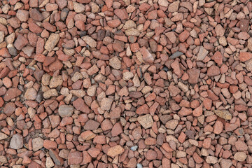 Red gravel rocks, small stones, textured background
