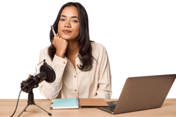 Filipino woman podcasting with mic and laptop