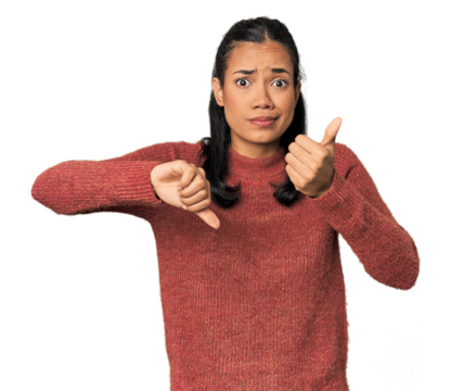 Young Filipina woman showing thumbs up and thumbs down, difficult choose concept