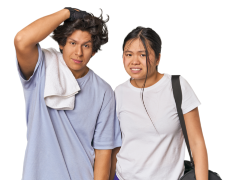 Young interracial athletic couple in studio being shocked, she has remembered important meeting.