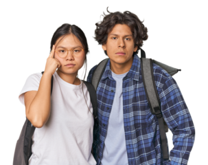Young interracial student couple studying pointing temple with finger, thinking, focused on a task.