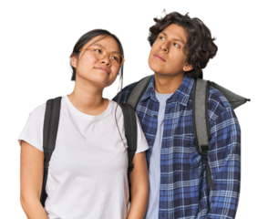 Young interracial student couple studying dreaming of achieving goals and purposes