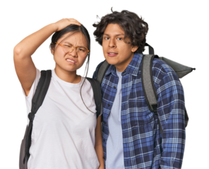 Young interracial student couple studying being shocked, she has remembered important meeting.
