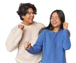 Young interracial couple in studio dancing and having fun.