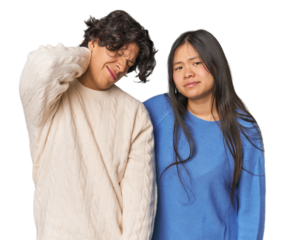 Young interracial couple in studio having a neck pain due to stress, massaging and touching it with hand.