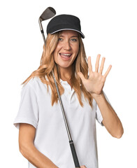 Young blonde golfer in studio smiling cheerful showing number five with fingers.