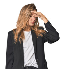 Young businesswoman in a suit having a head ache, touching front of the face.