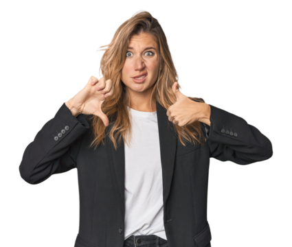 Young businesswoman in a suit showing thumbs up and thumbs down, difficult choose concept