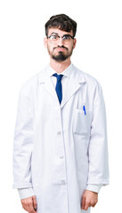 Young professional scientist man wearing white coat over isolated background puffing cheeks with funny face. Mouth inflated with air, crazy expression.