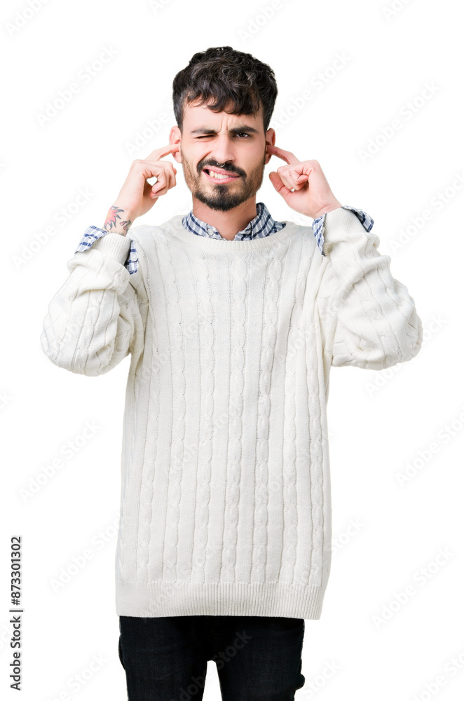 Sticker young handsome man wearing winter sweater over isolated background covering ears with fingers with a