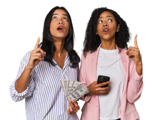 Latin businesswomen with money, phone pointing upside with opened mouth.