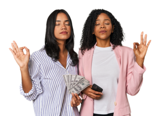 Latin businesswomen with money, phone relaxes after hard working day, she is performing yoga.