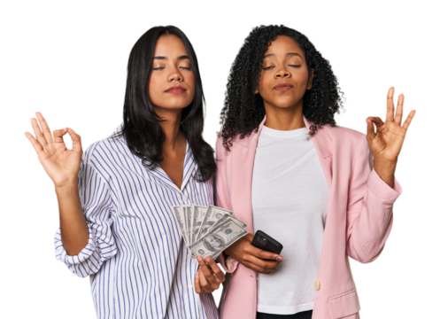 Latin businesswomen with money, phone relaxes after hard working day, she is performing yoga.