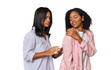 Young Latin businesswomen in studio having a shoulder pain.