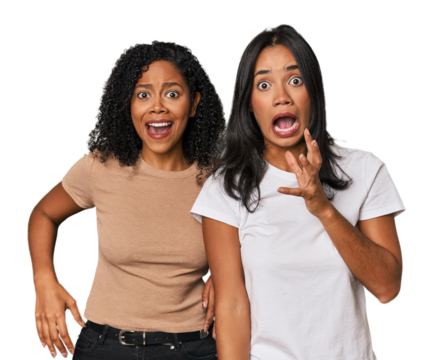 Young Latin friends in studio screaming to the sky, looking up, frustrated.