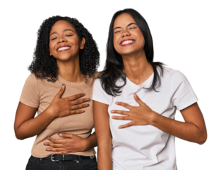 Young Latin friends in studio laughs happily and has fun keeping hands on stomach.