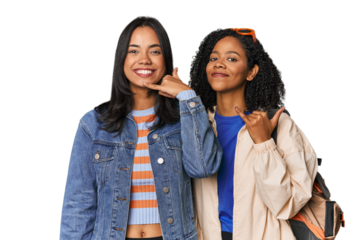 Latin friends ready for vacation showing a mobile phone call gesture with fingers.