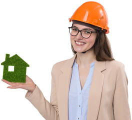 A girl in a construction helmet holds a green house. The concept of ecological clean housing.