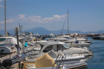 Boats in the marina. Beautiful white yachts parked on the sea coast, Naples, Italy