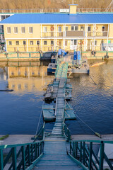 Fototapeta premium Wooden floating bridge on the Oka River in Nizhny Novgorod at sunset