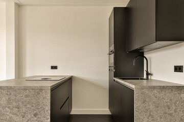 Modern kitchen corner with sleek design and marble countertops