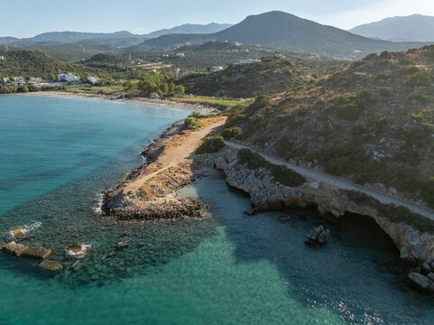 Greece - Crete - The famous Almyros beach is one of the most beautiful sandy beaches in Crete, with a small stream flowing into the sea nearby. The town of Agios Nikolaos is nearby