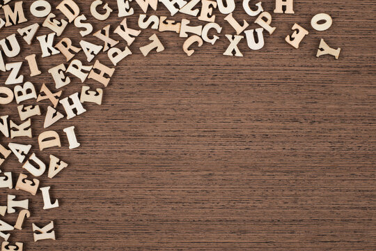 Vintage Wooden Letters on Brown Wooden Background Copy Space