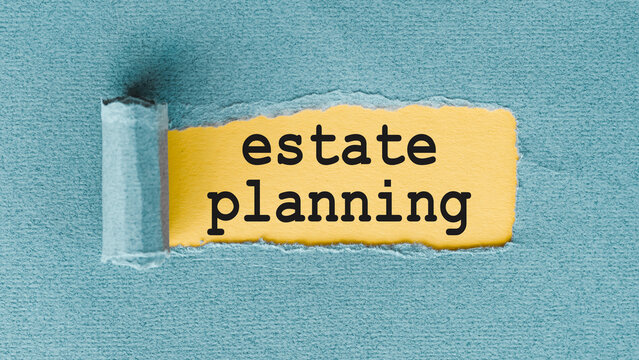 Estate Planning Written On Yellow Paper With Torn Edges