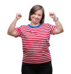 Young adult woman with down syndrome over isolated background showing arms muscles smiling proud....