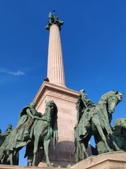 Obraz premium Details of Heroes' Square, (Budapest), one of the major squares in Budapest, Hungary, noted for its iconic Millennium Monument with statues featuring the Seven chieftains of the Magyars.