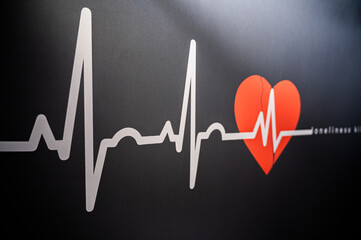heart beat diagram and red heart on black background