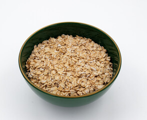 Delicious nutritious and healthy fresh old fashioned oatmeal on white background , top view