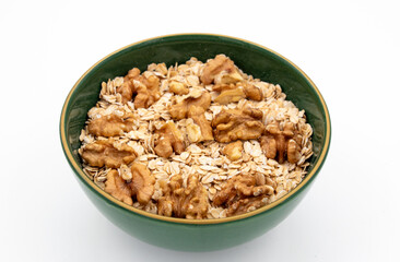 Delicious nutritious and healthy fresh old fashioned oatmeal on white background , top view