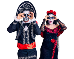 Young couple wearing mexican day of the dead costume over background trying to open eyes with fingers, sleepy and tired for morning fatigue