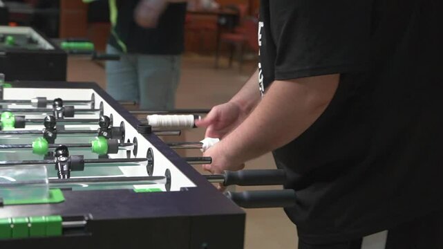 Foosball table arm grip up