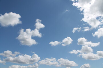 Clouds in a blue sky ,white fluffy clouds on a back ground of blue sky on a summers day Knottingley West Yorkshire In UK
