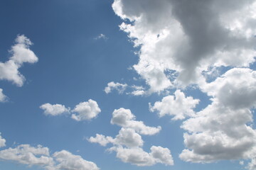 Clouds in a blue sky ,white fluffy clouds on a back ground of blue sky on a summers day Knottingley West Yorkshire In UK
