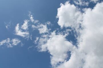 Clouds in a blue sky ,white fluffy clouds on a back ground of blue sky on a summers day Knottingley West Yorkshire In UK
