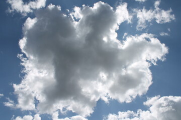 Clouds in a blue sky ,white fluffy clouds on a back ground of blue sky on a summers day Knottingley West Yorkshire In UK
